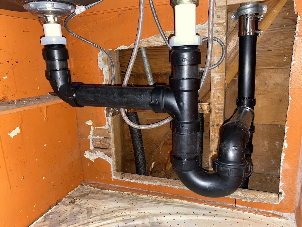 Professional Garbage Disposal Repair equipment and tools on the job in Chelsea